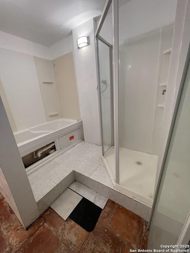 bathroom featuring an enclosed shower