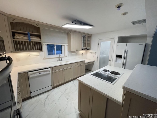 kitchen with sink and white appliances