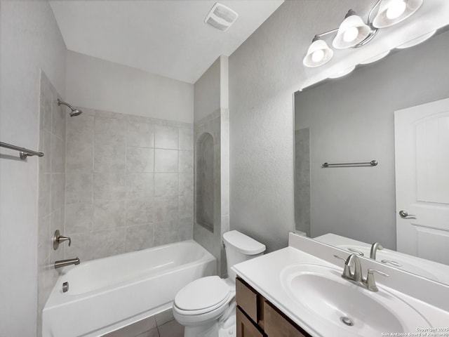 full bathroom featuring vanity, toilet, and tiled shower / bath combo