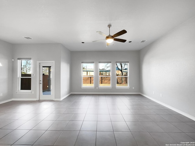 unfurnished room with tile patterned flooring and ceiling fan