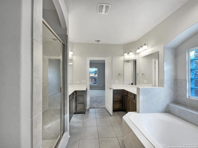 bathroom with vanity, tile patterned flooring, and independent shower and bath