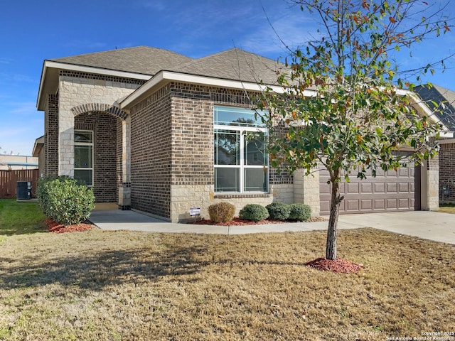 view of front of house with a garage and a front yard