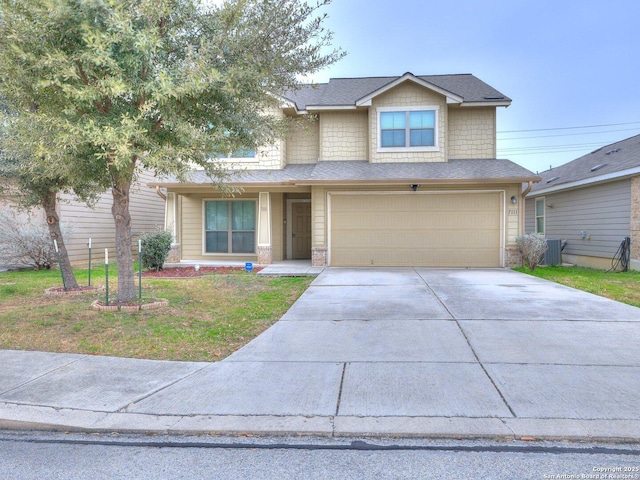 view of front of home with a garage and a front yard