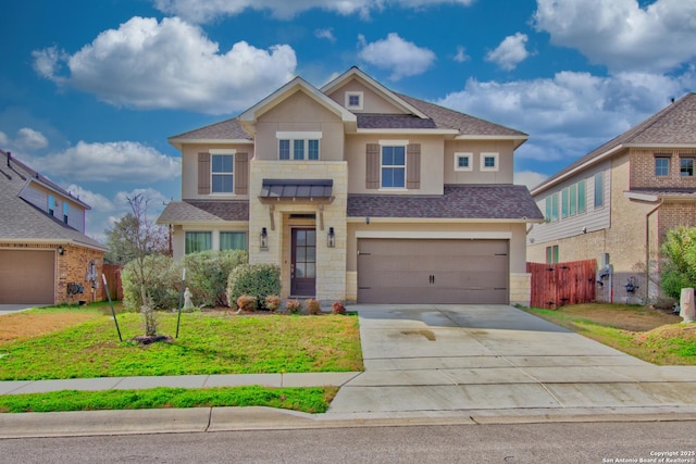 view of front of house featuring a garage and a front lawn