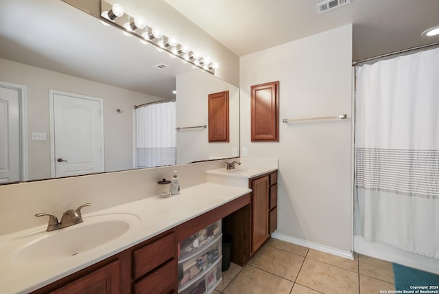 bathroom with shower / bath combination with curtain, tile patterned floors, and vanity