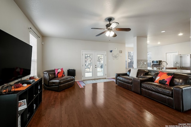 living room featuring dark wood-type flooring, ceiling fan, and french doors