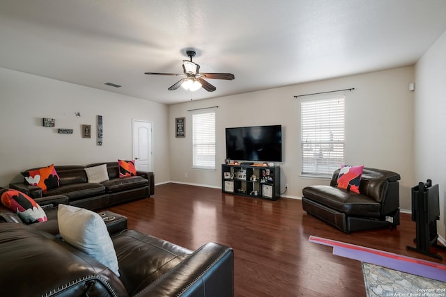 living room with ceiling fan and dark hardwood / wood-style flooring