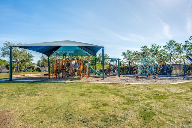 view of playground with a lawn