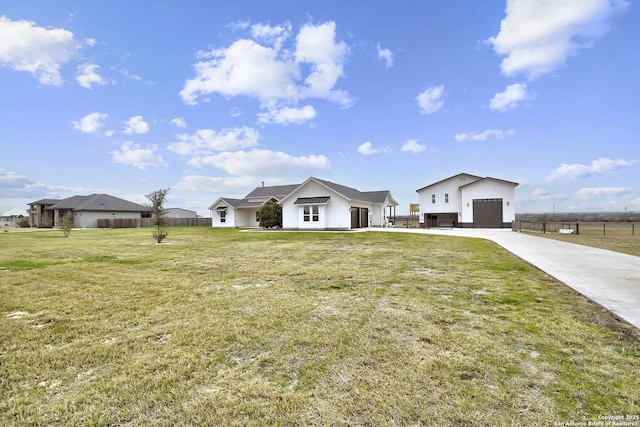 view of front facade with a garage and a front lawn