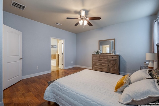 bedroom featuring connected bathroom, wood-type flooring, and ceiling fan