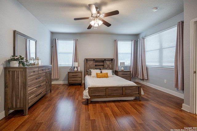 bedroom with dark wood-type flooring and ceiling fan