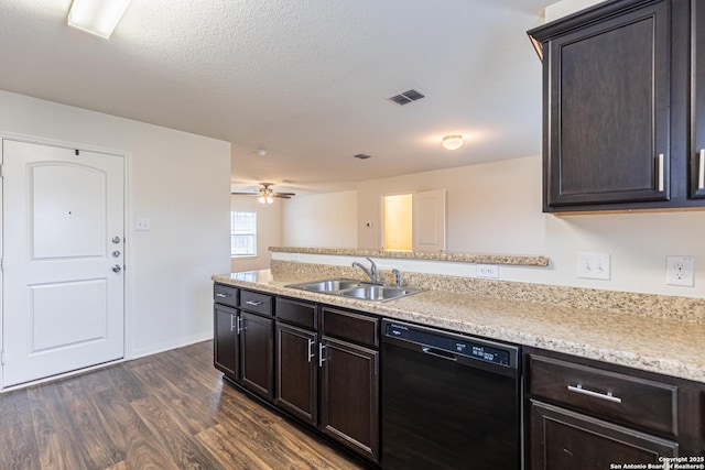 kitchen featuring black dishwasher, sink, dark hardwood / wood-style flooring, ceiling fan, and a textured ceiling