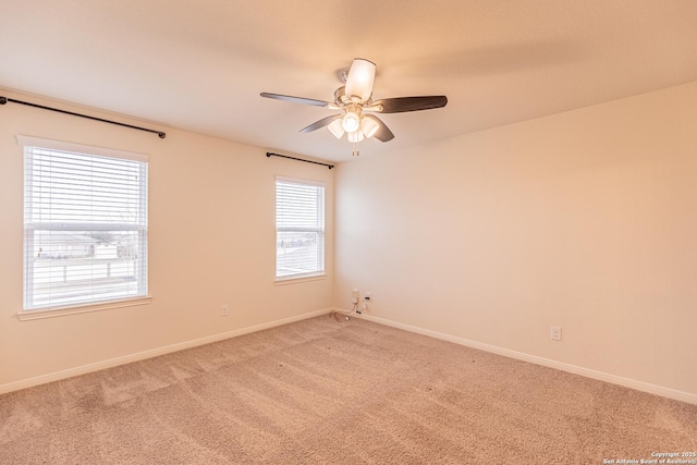 spare room with carpet flooring and ceiling fan