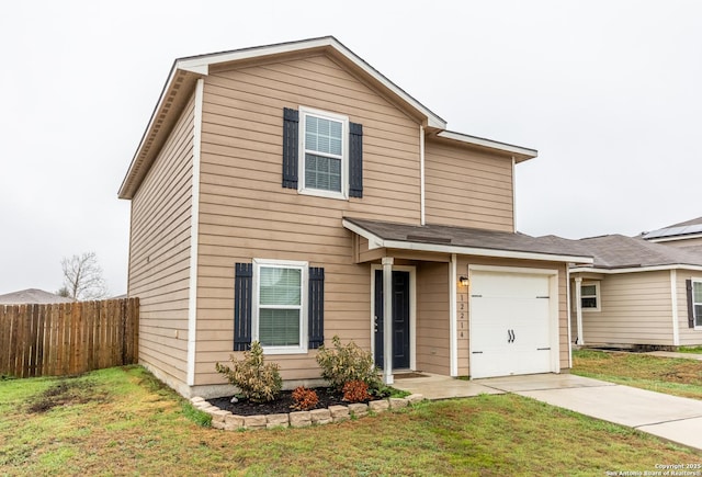 view of front facade featuring a garage and a front yard