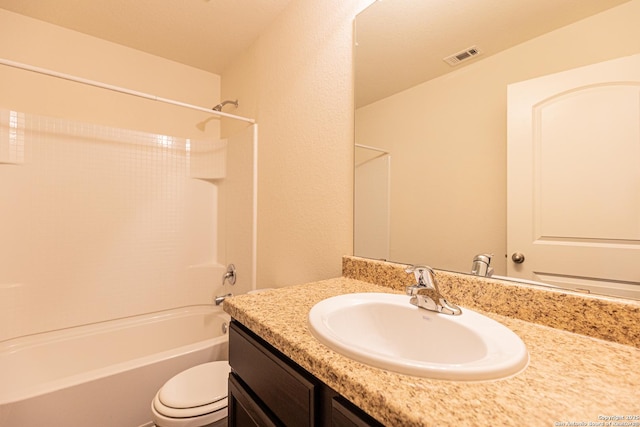 full bathroom featuring vanity, tub / shower combination, and toilet