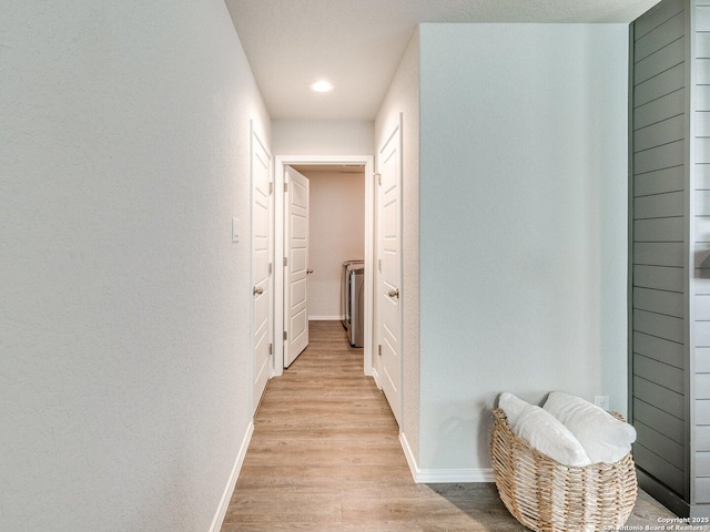 corridor featuring light hardwood / wood-style floors