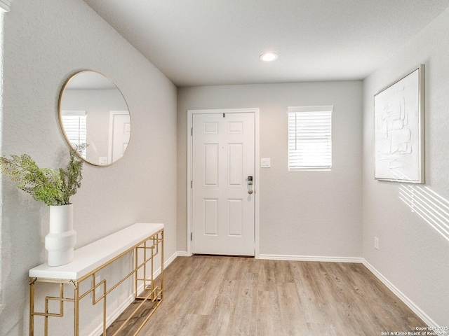 entryway with light hardwood / wood-style flooring