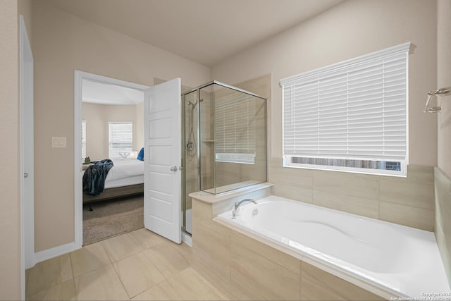 bathroom featuring tile patterned floors and independent shower and bath