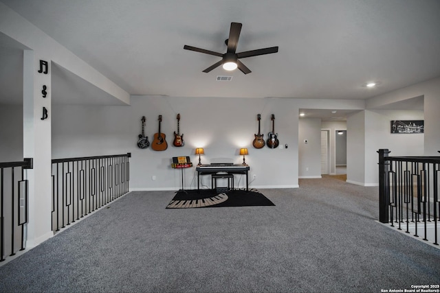 interior space with ceiling fan and carpet floors