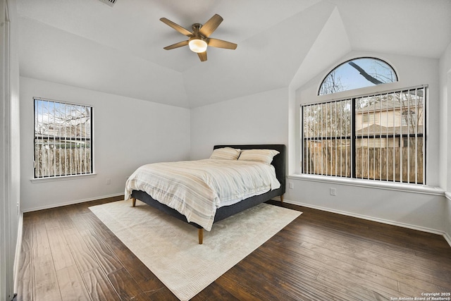 bedroom with dark wood-type flooring, ceiling fan, and lofted ceiling