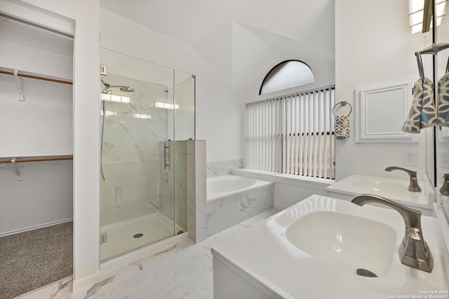 bathroom featuring lofted ceiling, vanity, and plus walk in shower