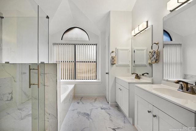 bathroom featuring vanity, vaulted ceiling, and plus walk in shower