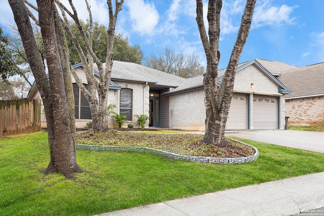 view of front of property with a garage and a front yard