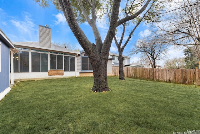 view of yard with a sunroom