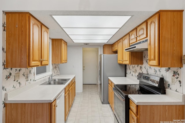 kitchen with tasteful backsplash, sink, and appliances with stainless steel finishes