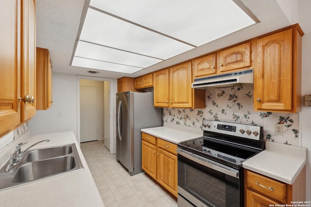 kitchen with stainless steel appliances, sink, and backsplash