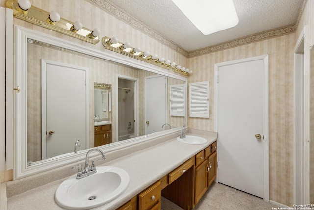 bathroom with vanity and a textured ceiling