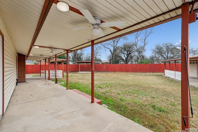 view of yard featuring a patio area and ceiling fan