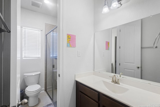 bathroom featuring vanity, toilet, and walk in shower