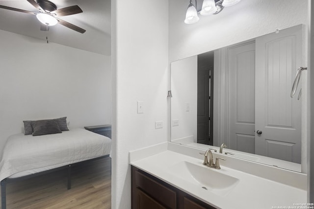 bathroom featuring vanity, wood-type flooring, and ceiling fan