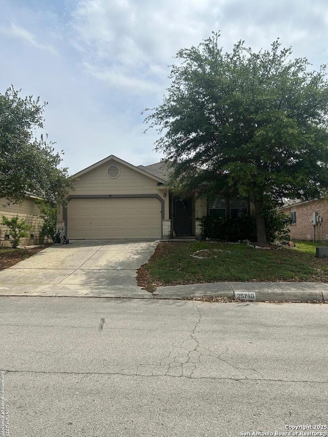 25710 Presidio Aly, Boerne, TX 78015 - view of front facade with driveway and a garage