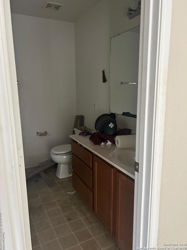 25710 Presidio Aly, Boerne, TX 78015 - bathroom with tile patterned flooring, toilet, vanity, and visible vents