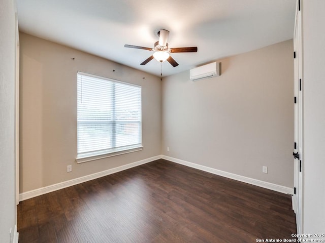 empty room with ceiling fan, a wall mounted air conditioner, and dark hardwood / wood-style flooring