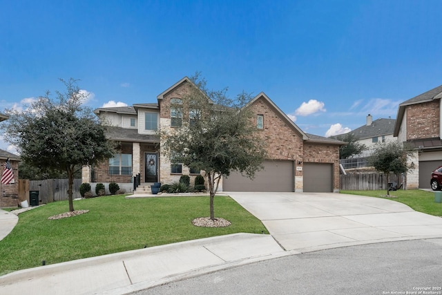 view of front of house featuring a garage and a front lawn