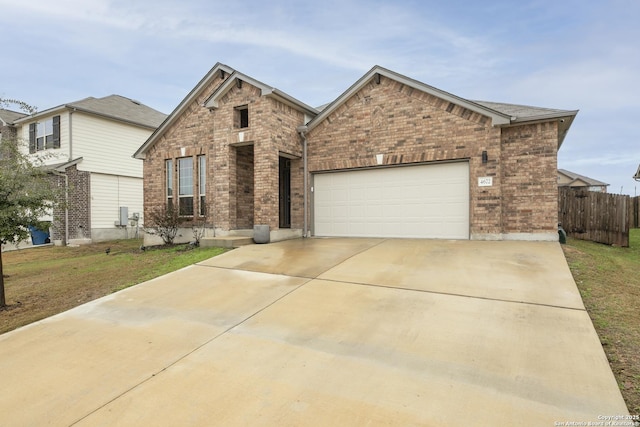 view of front of property featuring a garage and a front yard