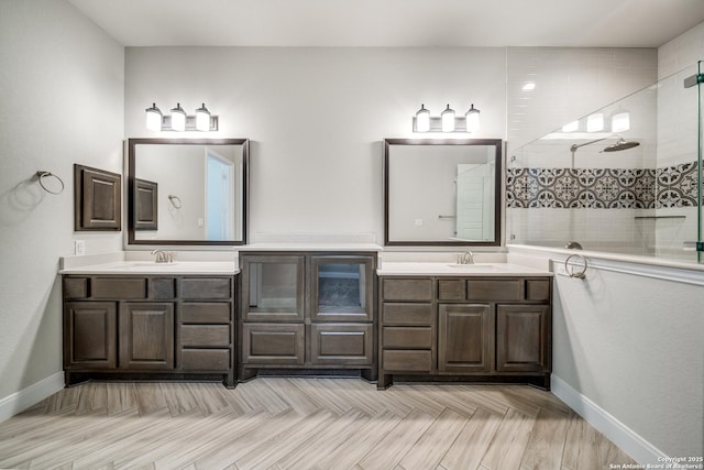 bathroom with vanity and tiled shower