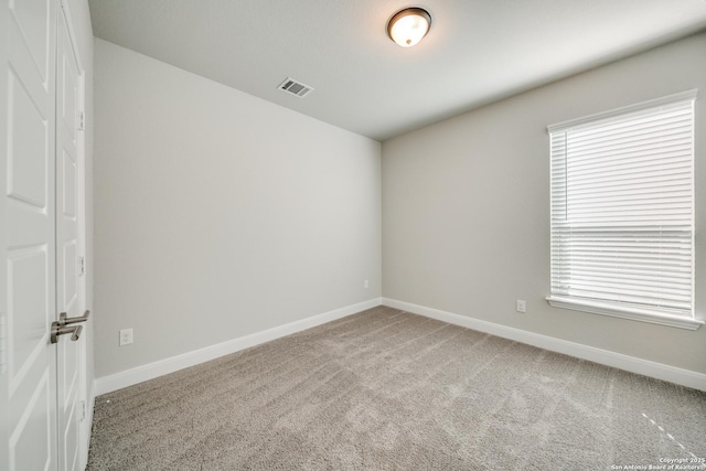 empty room with carpet flooring