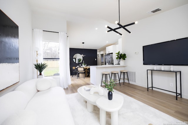 living room featuring sink and light wood-type flooring