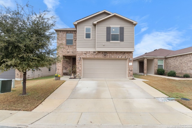 view of front property featuring a garage, central AC, and a front yard