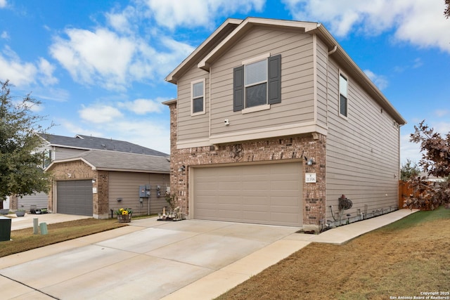 view of front of property with a garage and a front yard