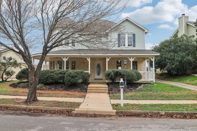 country-style home featuring a porch