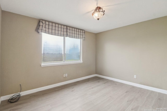 unfurnished room with light hardwood / wood-style flooring