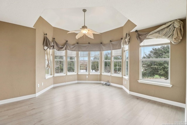 empty room featuring ceiling fan and light hardwood / wood-style floors