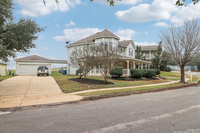 view of front facade featuring a porch, a garage, and a front yard