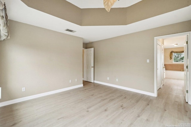 unfurnished room featuring light wood-type flooring