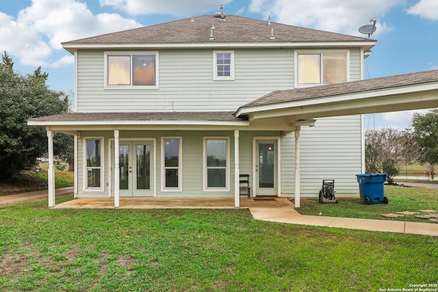 back of house featuring a lawn